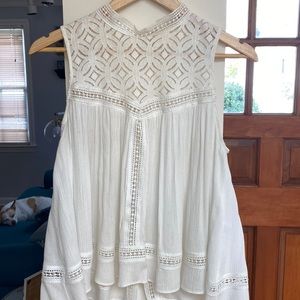 Delicate white mock neck swing tank